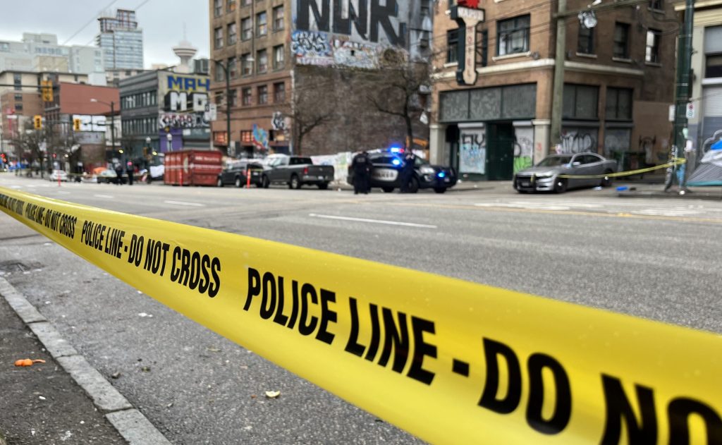 Crime scene tape blocks a large section of East Hastings street in Vancouver