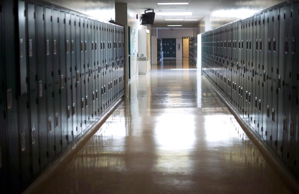 An empty hallway is seen at a school