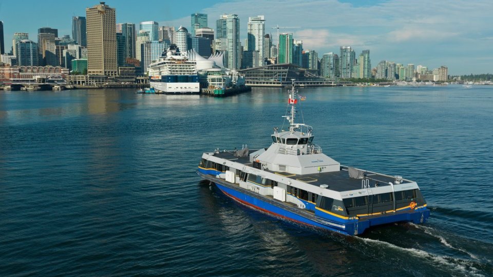 A SeaBus crosses the Burrard Inlet from North Vancouver to Vancouver