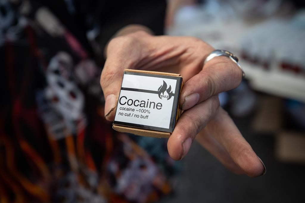Martin Steward holds cocaine he received from the Drug User Liberation Front, which was handing out a safe supply of illicit drugs in the Downtown Eastside