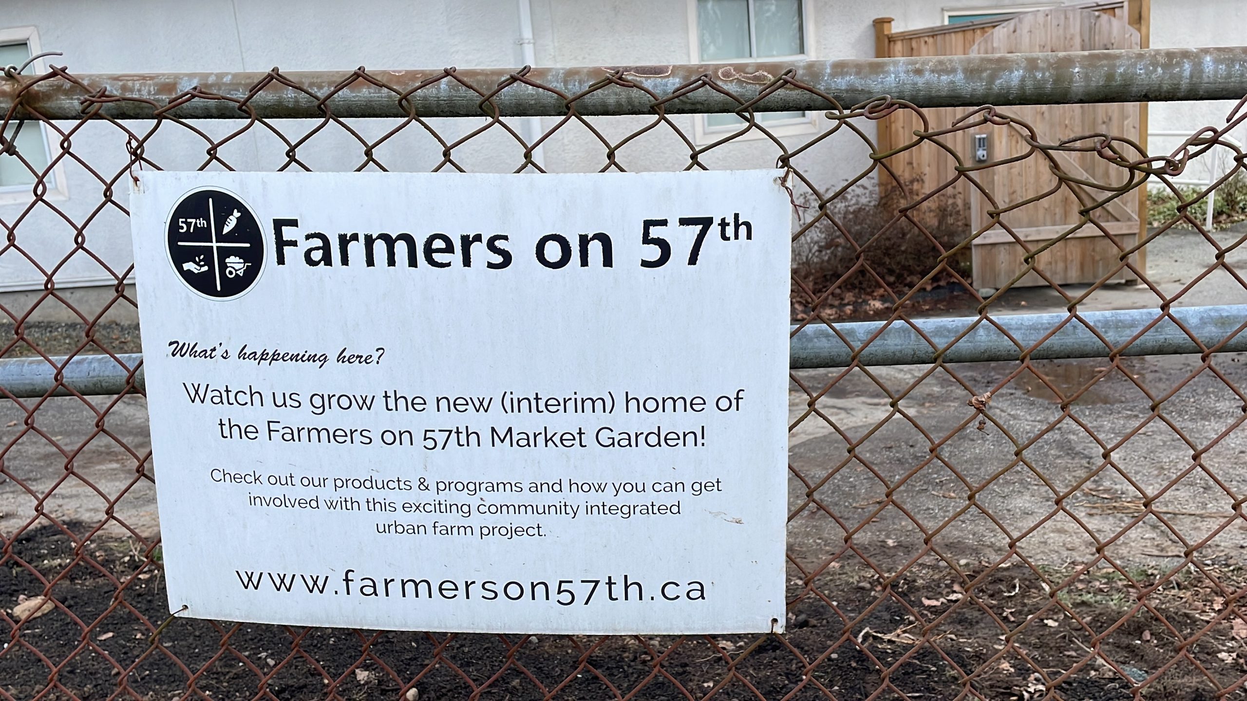 A Farmers on 57th sign is shown.