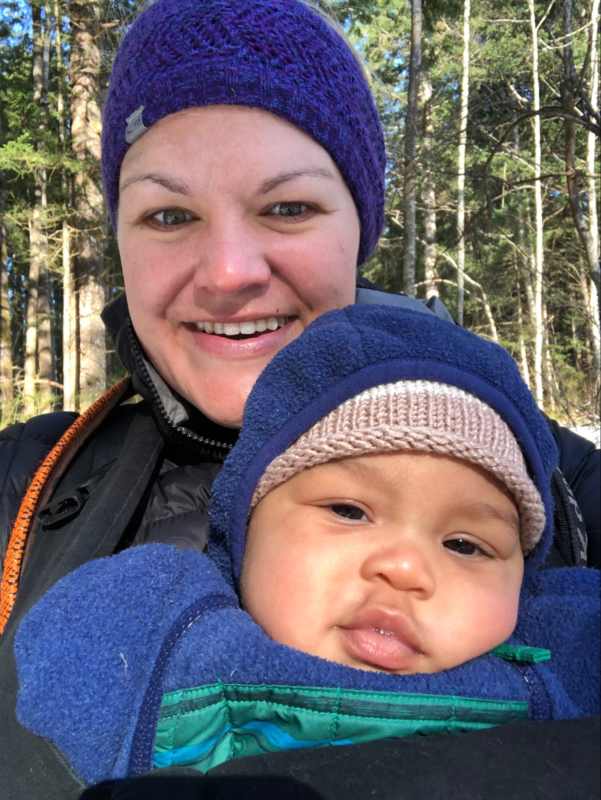 New B.C. mom Holly Noot and her baby pictured outside wearing toques and winter coats