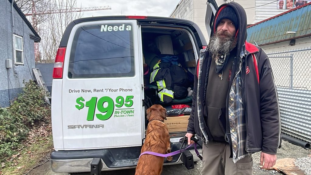 Basaraba was diagnosed with MS in 2010. He is pictured with his 11 year old dog Wookley beside his van. He says pet friendly housing has become unaffordable in Metro Vancouver.