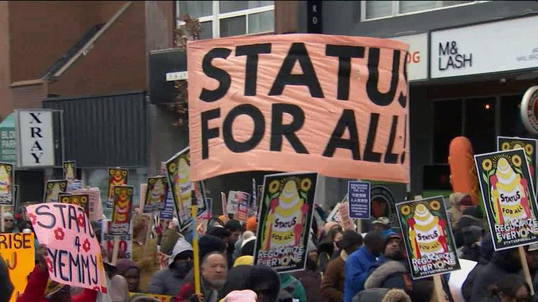 Hundreds rally in Toronto on March 19, calling for permanent resident status for all migrant and undocumented workers.