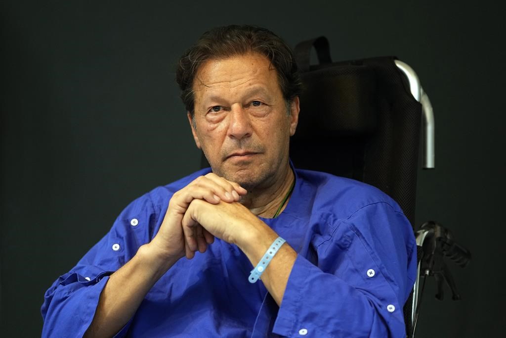 Former Pakistani Prime Minister Imran Khan speaks during a news conference in Shaukat Khanum hospital, where is being treated for a gunshot wound in Lahore, Pakistan, on Nov. 4, 2022. Pakistani police used water cannons and fired tear gas to disperse supporters of Khan Wednesday, March 8, 2023, in the eastern city of Lahore. Two dozen Khan supporters were arrested for defying a government ban on holding rallies, police said.