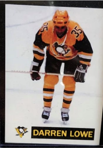 a hockey card features Darren lowe on the ice wearing an orange and black jersey. The card is part of an extensive collection featuring black hockey players