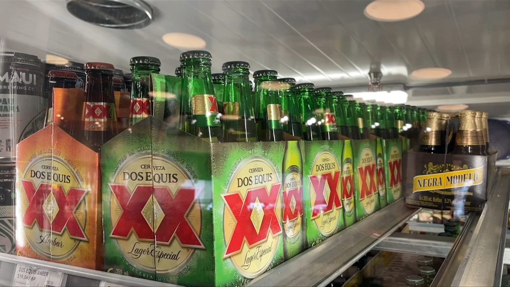 a row of alcohol at a liquor store. The federal alcohol tax is set to increase on april 1