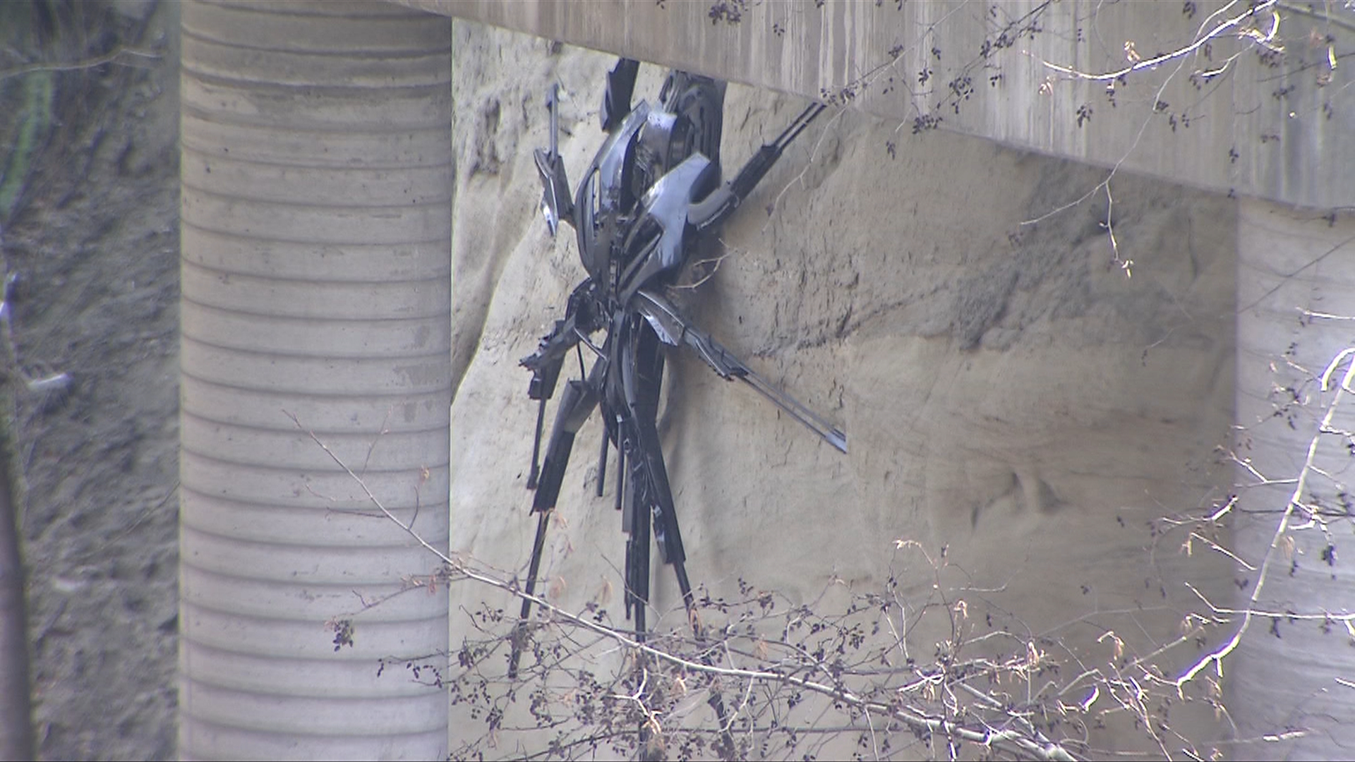 A giant spider sculpture under an East Vancouver bridge