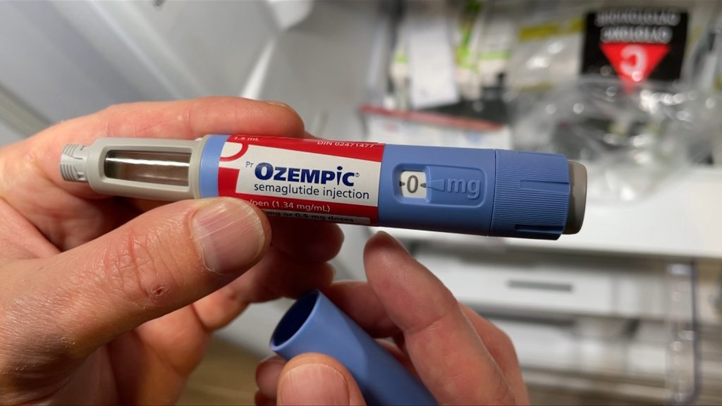 a syringe tpype thing of ozempic, a drug used for diabetes.