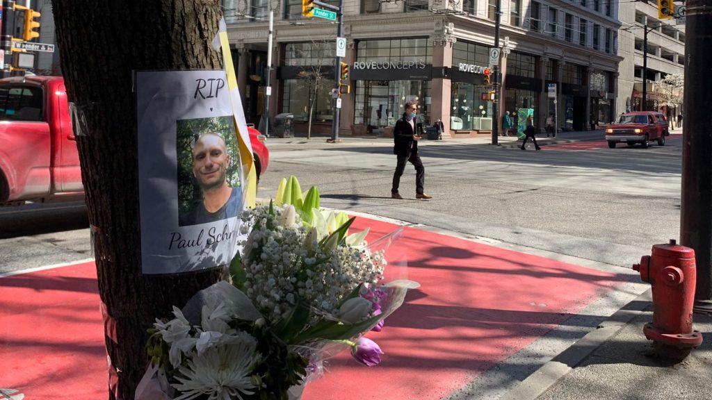 A memorial for Paul Schmidt, who was killed in a stabbing in downtown Vancouver, sits near the Starbucks where he was stabbed