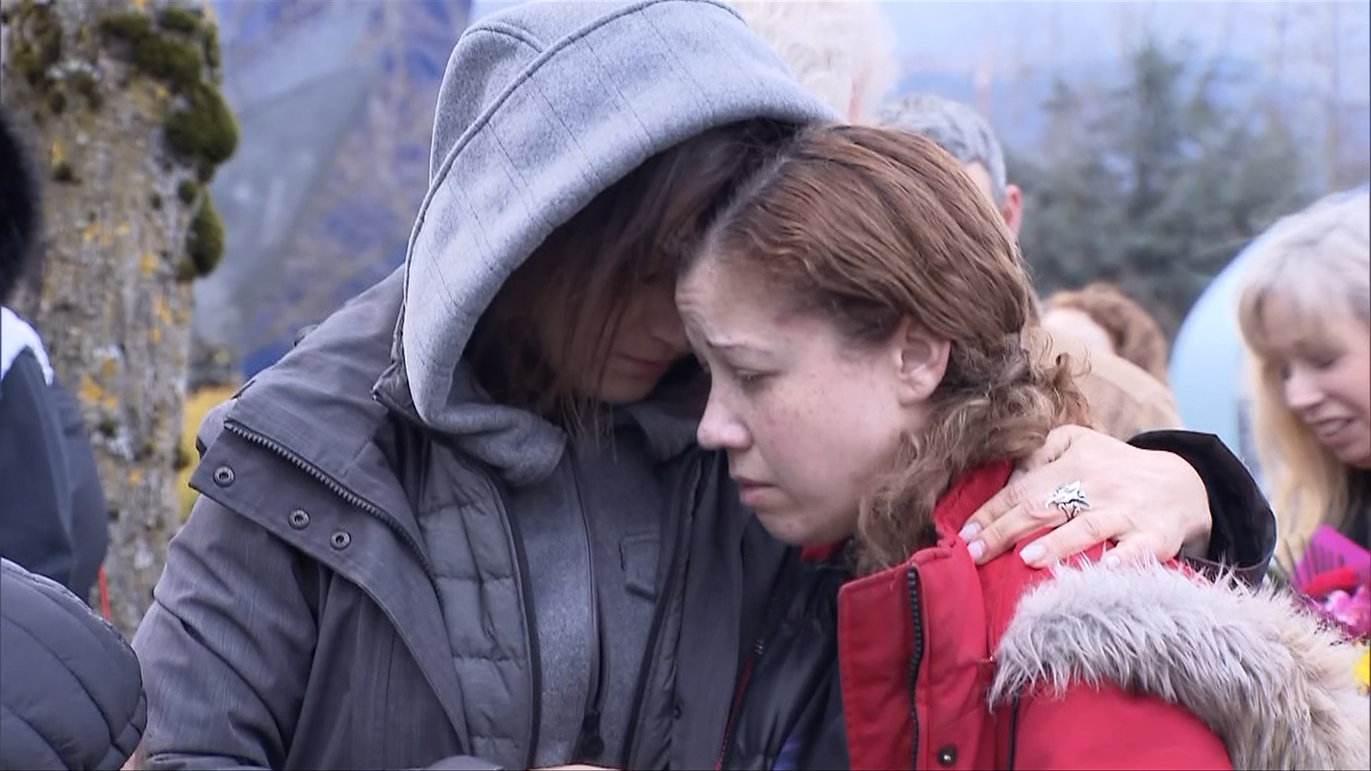 Ethan Bespflug's mother was comforted by friends, family, and strangers Tuesday at a candlelight vigil for her son who died after being stabbed on a bus in Surrey last week. (CityNews)