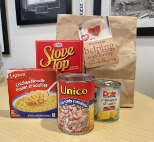 dry products, a can of soup stove top meal and beans are all part of a ready made hamper form the greater vancouver food bank