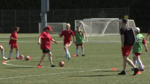 team canada players kicking a soccer ball/practicing in richmond