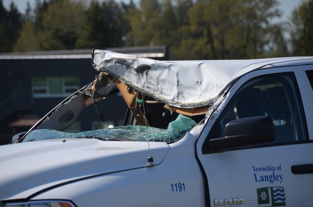 Damage is seen to a township of langley parks vehicle