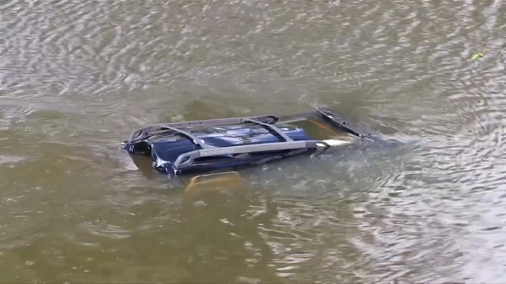 An SUV submerged in the Nicomekl River in Surrey after a crash