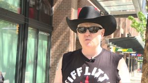 a man wearing a black cowbody had and glasses. garth mullins with VANDU speaks on safe supply