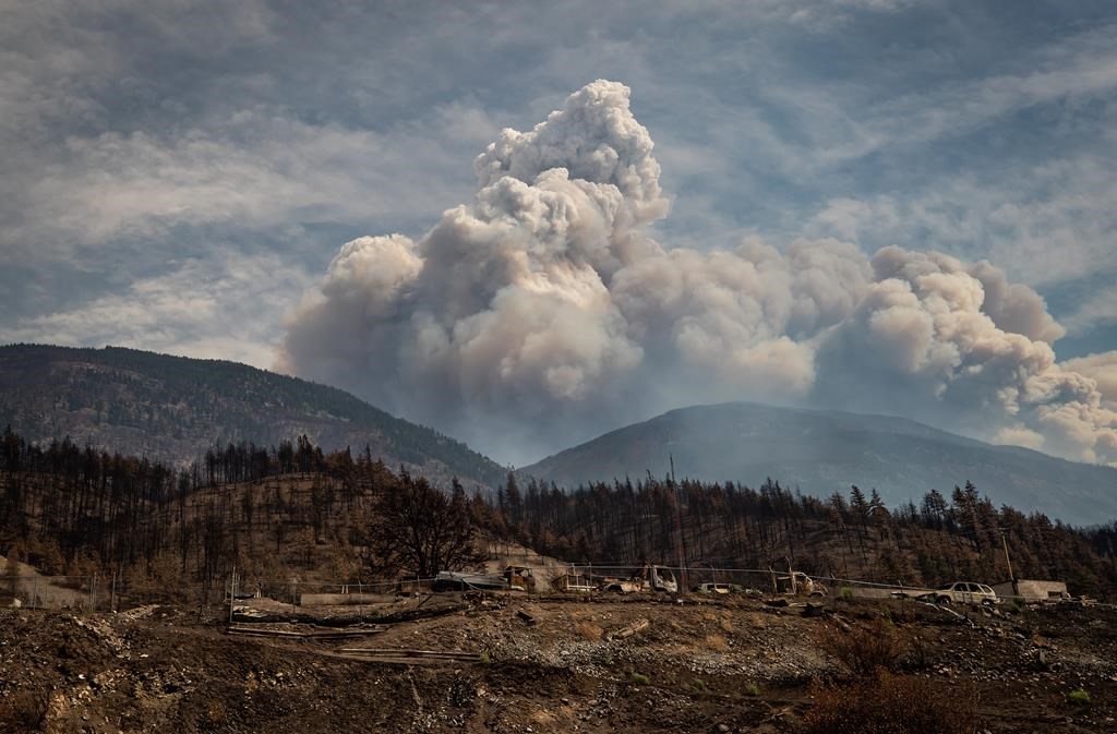 Two out-of-control wildfires in northeastern British Columbia have nearly doubled in size in one day