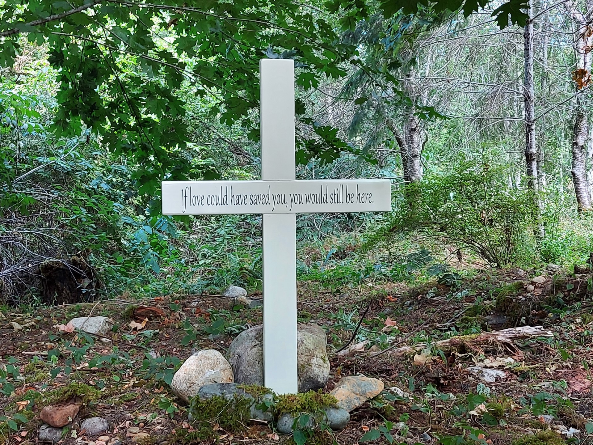 A cross sits in memory of Tyler, who was one of the victims in the Whiskey Creek incident of 2020