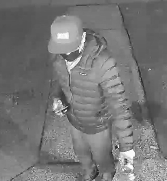 Surveillance footage of a suspect wanted in connection with an arson investigation