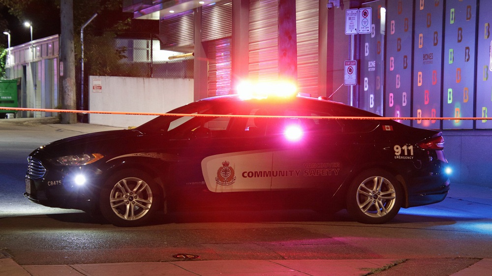 a vancouver police cruiser with lights flashing