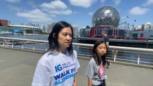 a child and woman walking in vancouver to raise awarenss about alzheimers 