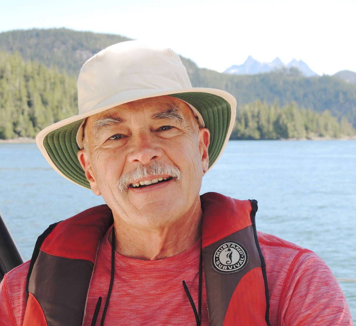 John Nightingale in front of a body of water