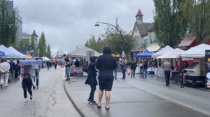 people walking down a street in surrey celebrate car free day on june 10