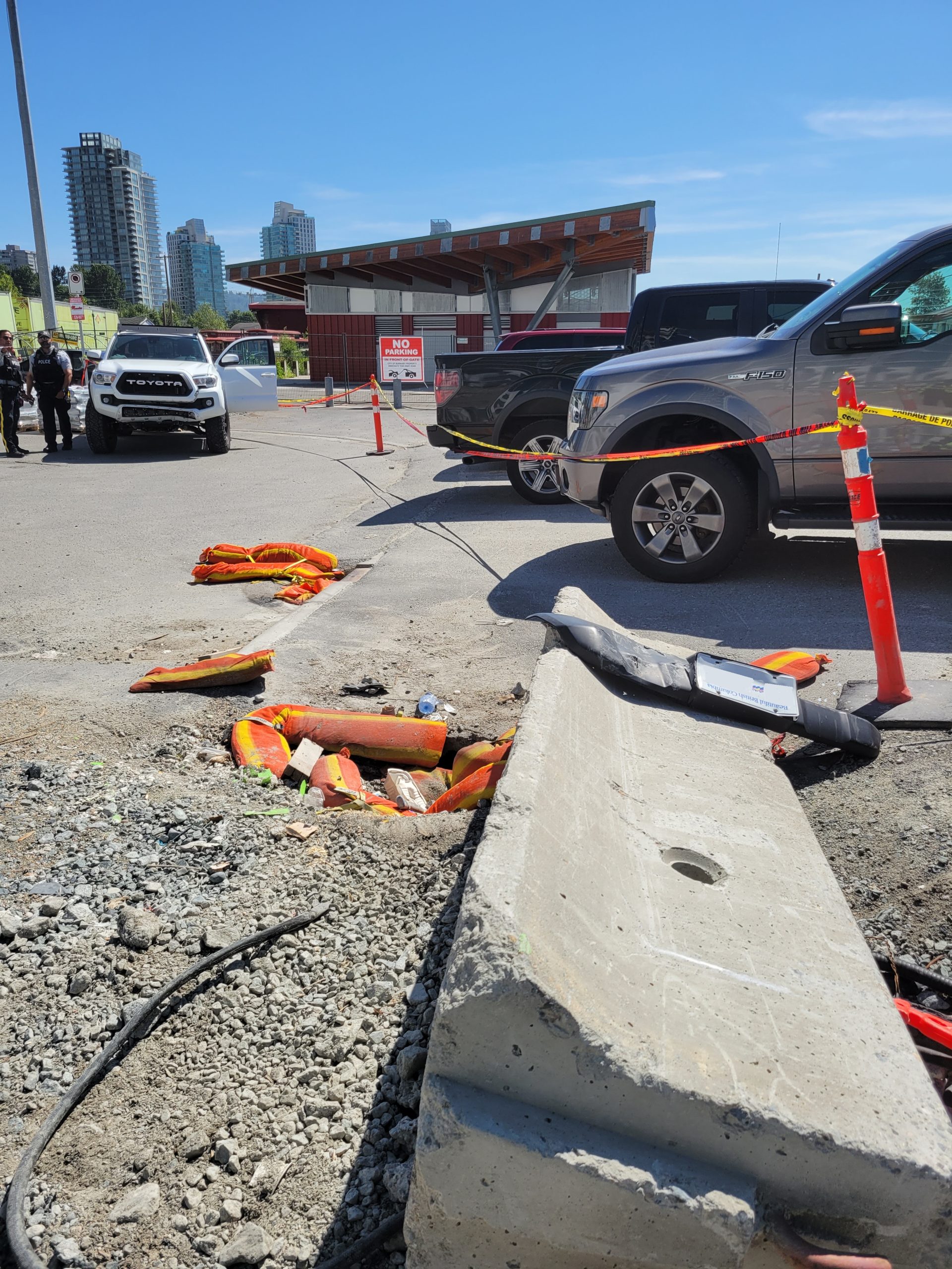 Debris at a construction site in Burnaby after a pickup truck crashed into a concrete block, which then hit another car