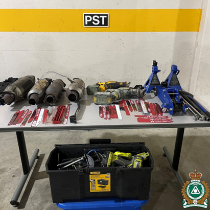 A table full of tools that were seized as part of an arrest of alleged catalytic converter thieves in Delta