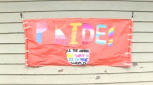 a sign with the words pride on it was made by elementary school students