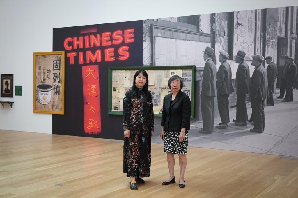 Chinese Canadian Museum CEO Dr. Melissa Karmen Lee, left, and board chair Grace Wong pose for a photograph ahead of the opening of the museum, in Vancouver, on Monday, June 26, 2023. The new museum is located in the historic Wing Sang Building, Vancouver Chinatown's oldest building, and opens to the public on July 1. THE CANADIAN PRESS/Darryl Dyck 