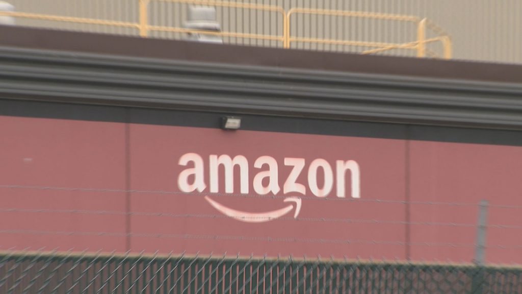 An Amazon logo is seen on the size of a building.