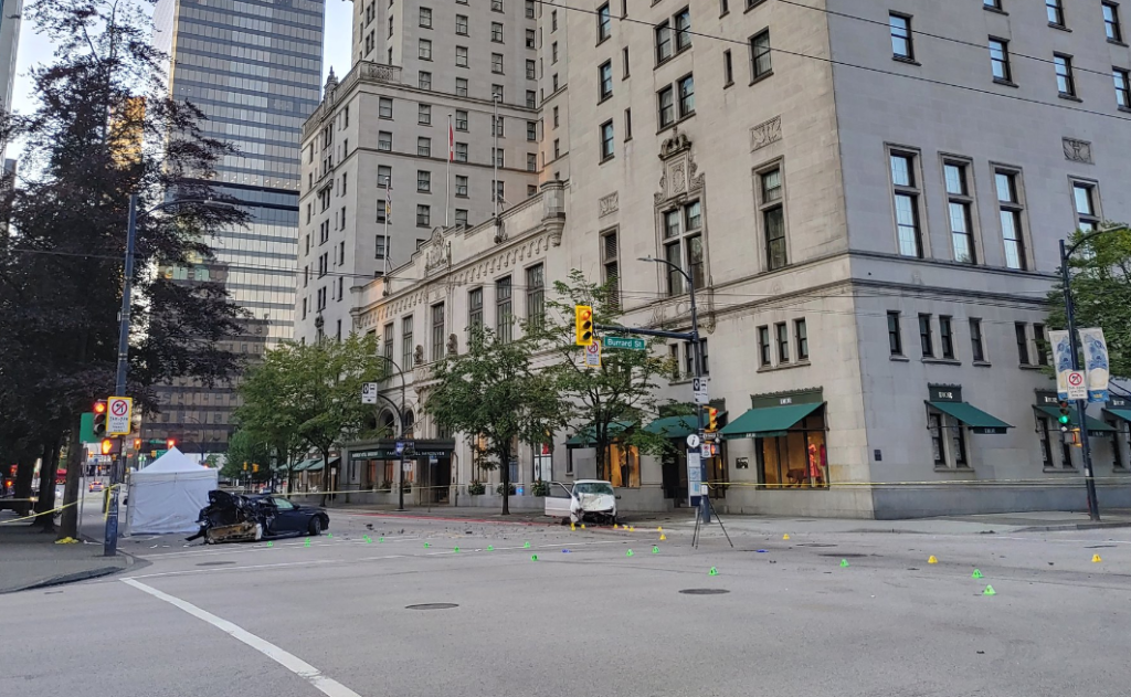 The intersection of West Georgia and Burrard streets is closed as Vancouver police officers are on scene investigating a fatal car crash.