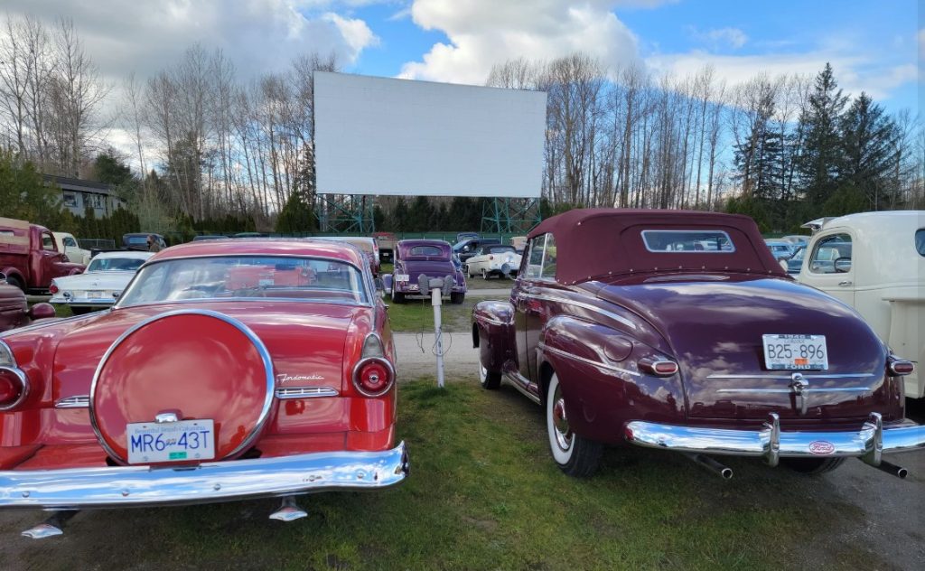 vintage cars outside a drive in movie theatre in langley