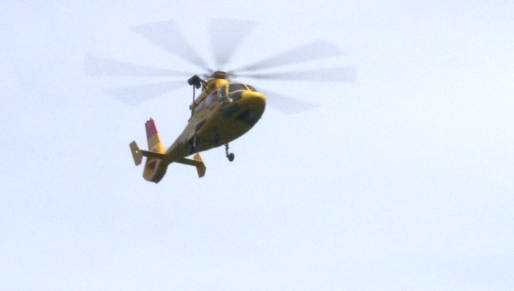 A helicopter hovers over Golden Ears Park