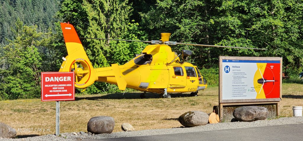 A helicopter supporting wildfire suppression efforts on Mount Seymour in the District of North Vancouver