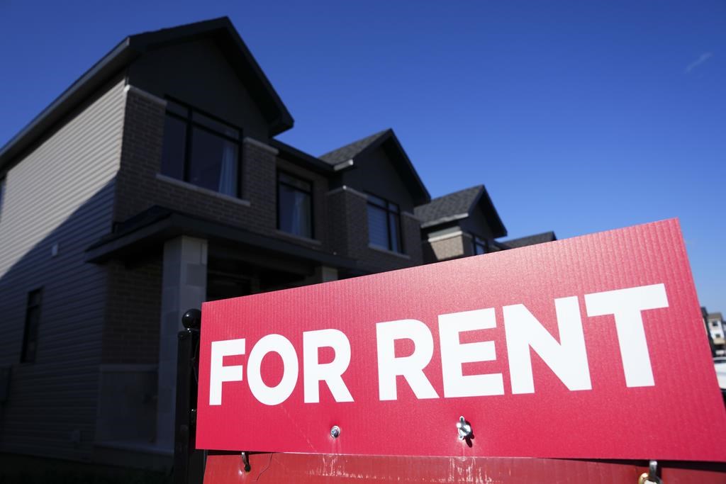 A for rent sign is displayed on a house in Ottawa on Oct. 14, 2022.