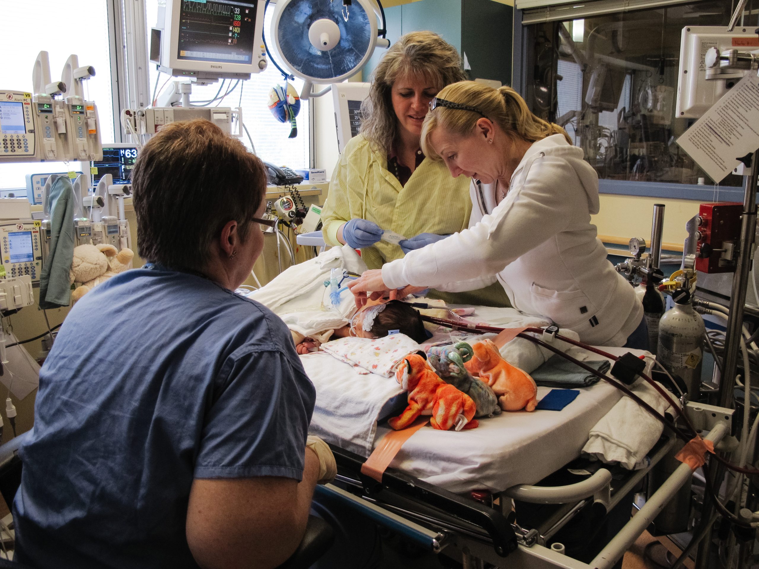 Addison McArthur as a baby in the hospital surrounded by health workers after her heart transplant. At less than one-month-old, Addison became the first baby to receive a heart transplant at BC Children's Hospital more than 12 years ago