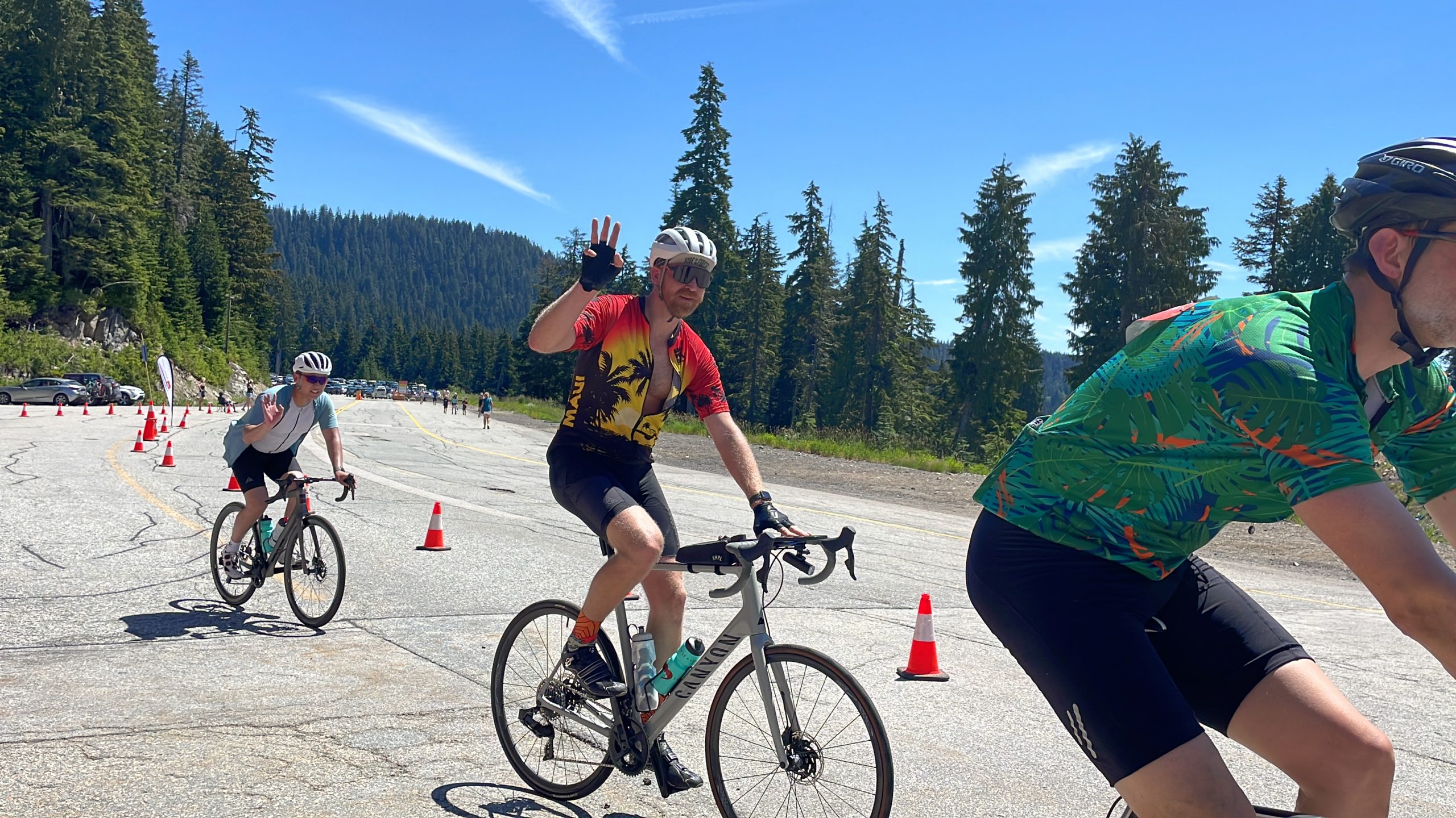 Cyclists wave as they compete in the Triple Crown for Heart bike race in B.C.