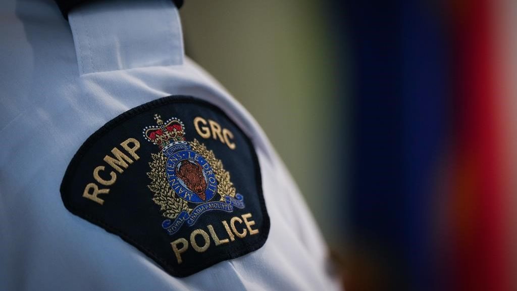 An RCMP patch is seen on the shoulder of a Surrey RCMP Officer in Charge during a news conference in Surrey, B.C., on Friday, April 28, 2023.