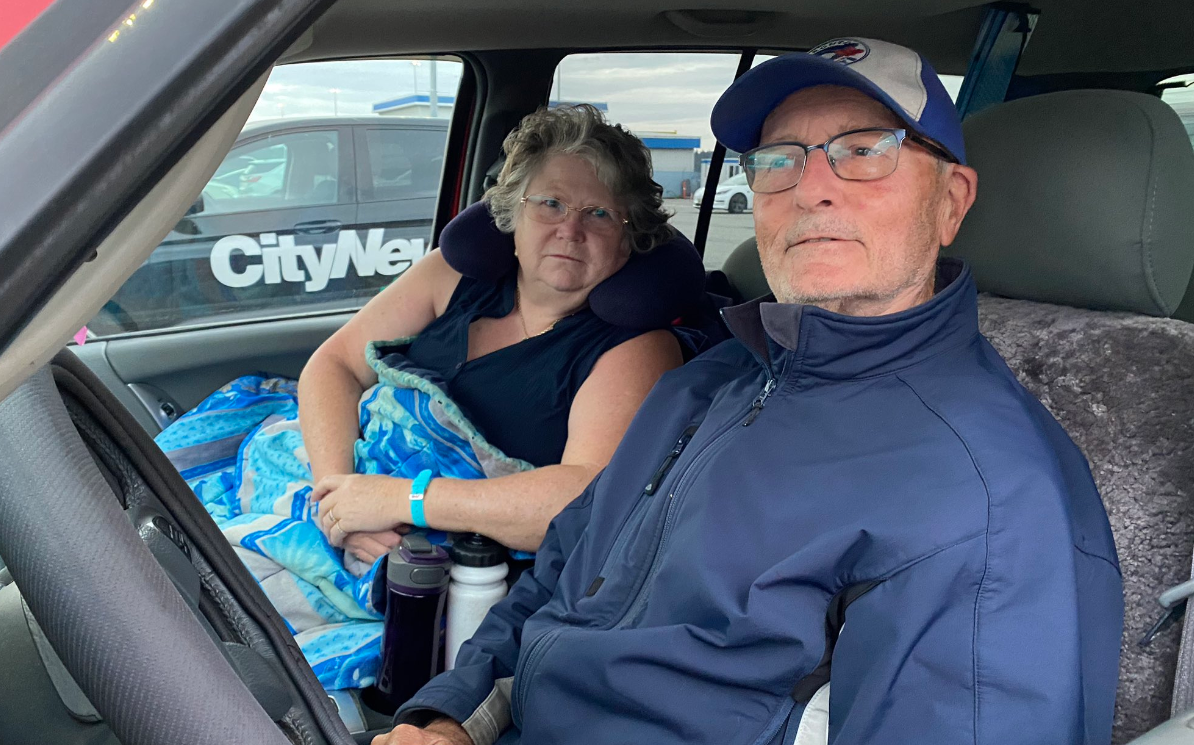 Colleen and Ron Gunter sit in their vehicl at the Tsawwassen Ferry Terminal as BC Ferries sees major sailing waits on July 25, 2023