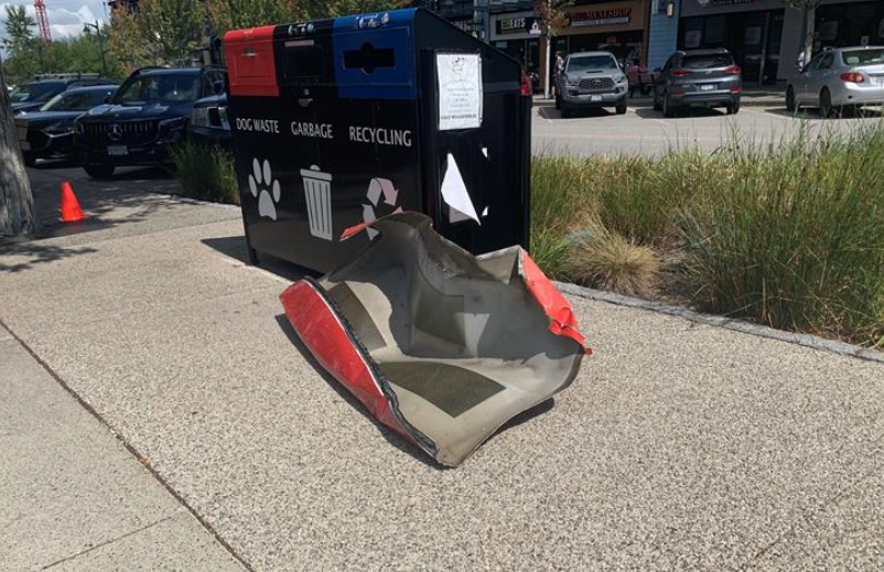 The hood of a vehicle on a sidewalk in Langley's Willoughby Town Centre area after a vehicle explosion on July 26, 2023. (Michael Williams, CityNews Image)