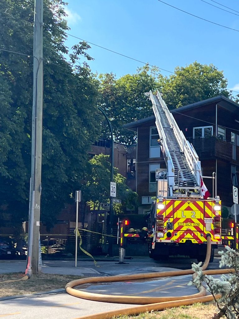 a fire truck seen outside of a fire that ripped through an apartment building in vancouver's mount pleasant neighbourhood thursday night
