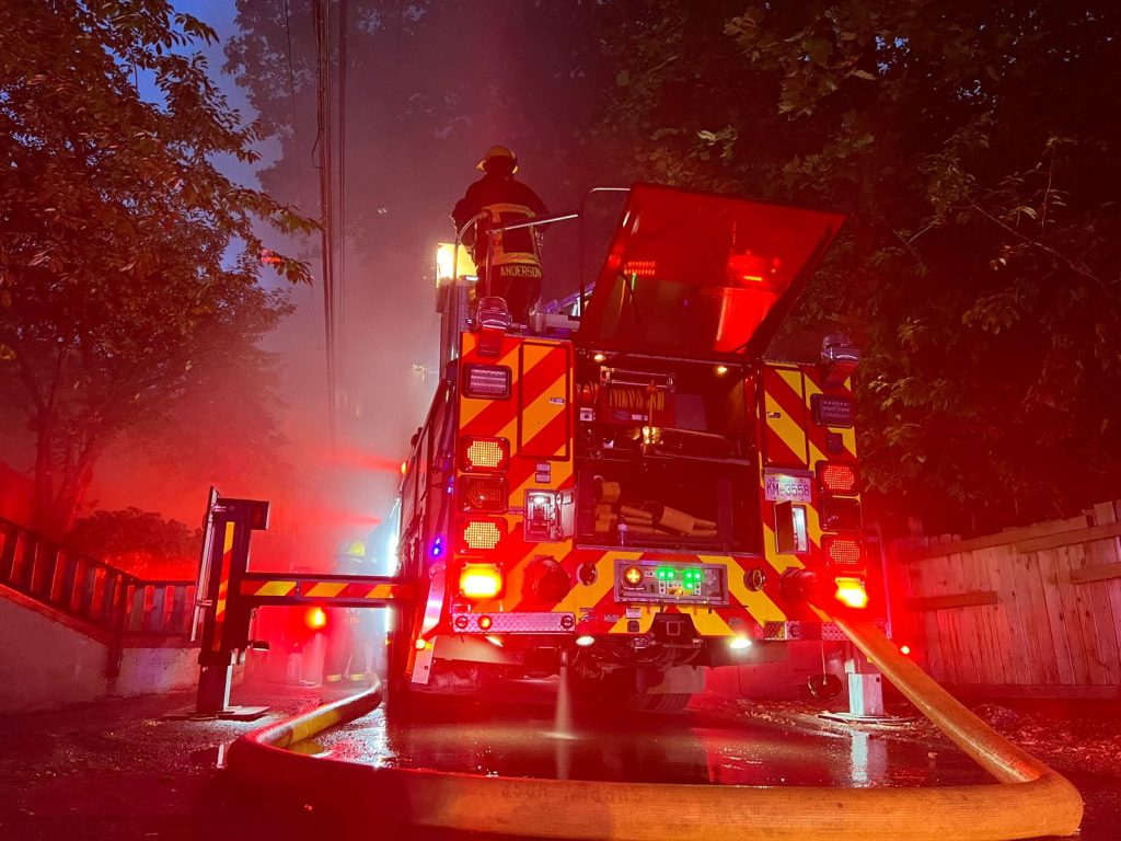 a fire truck seen outside of a fire that left more than 70 people displaced