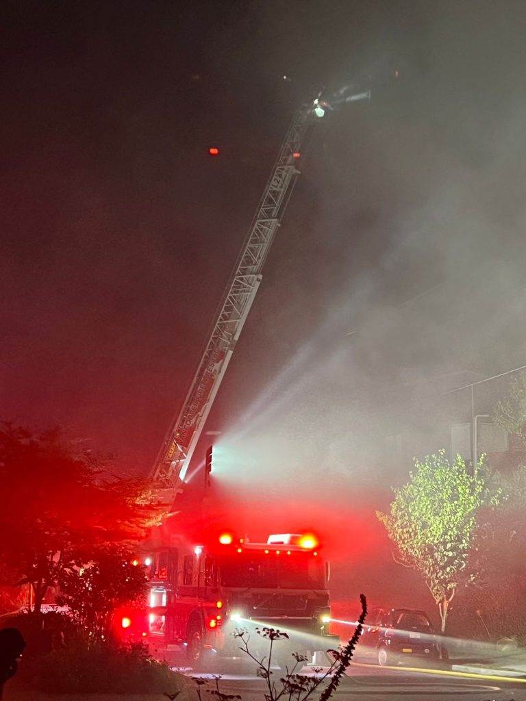 a large latter seen raised on top of a fire truck at the scene of a fire that left more than 70 people dispalced thursday nigh