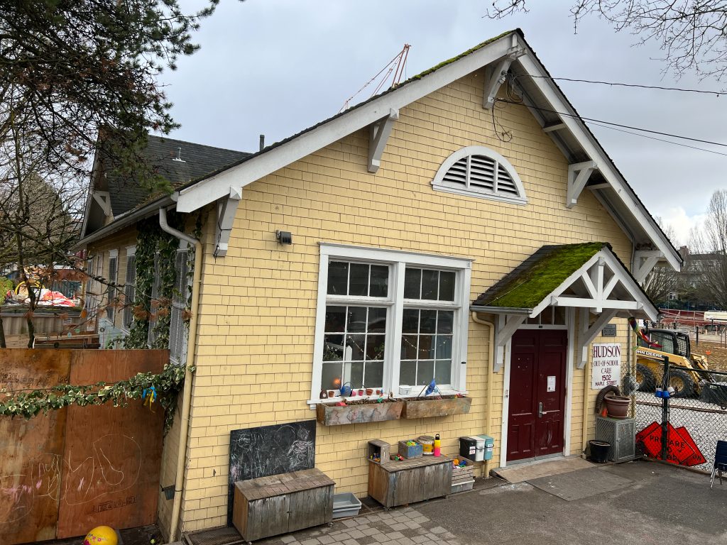 the outside of a historic yellow builiding will serve as a centre to teach children the squamish language and help preserve cultural values