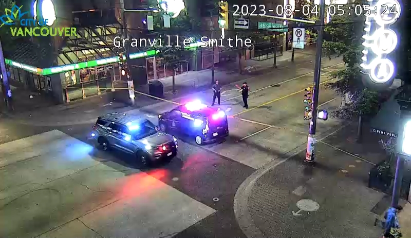 Vancouver police vehicles at the intersection of Granville and Smithe streets after a stabbing
