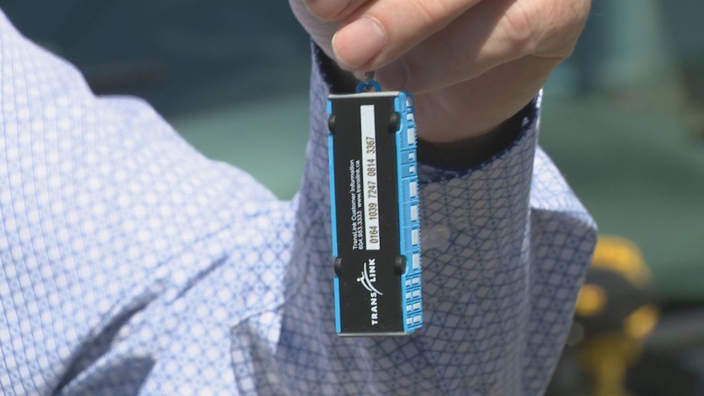 Someone holding a TransLink Trolley Bus Keychain