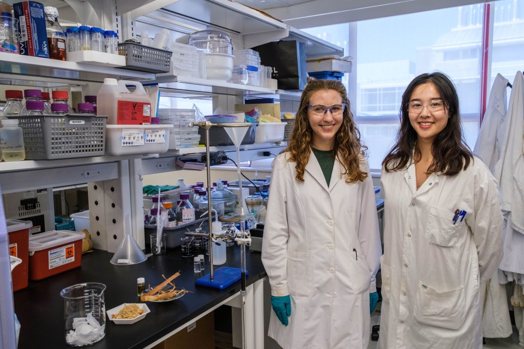 Marina Mehling (left) and Tianyu Guo (right) stand in a lab