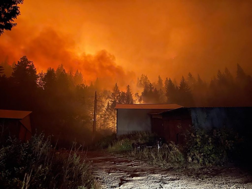 Flames are seen above a hill in Sorrento